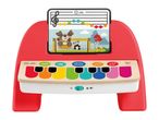 Red and white toy piano with colorful keys and a music sheet featuring cartoon animals.