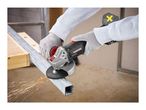 Person cutting metal with an angle grinder, sparks flying.