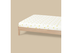 Livarno Jersey Fitted Sheet with lemon pattern on a wooden bed frame
