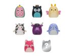 Collection of squishy toys including a watermelon, owl, butterfly, cow, bull, seal, and fox.