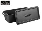 Black cast iron loaf pan with lid, featuring a textured surface and handles.