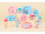 Peppa Pig tableware and bottles: plates, cups, containers, and soothers.