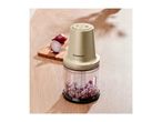 Silvercrest food chopper with chopped red onions on a wooden surface.