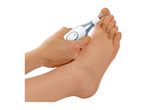 A person's hand holding an electric nail file to trim the toenails on their foot.
