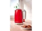 Red Silvercrest 3100 W kettle on a kitchen counter, with cookies.