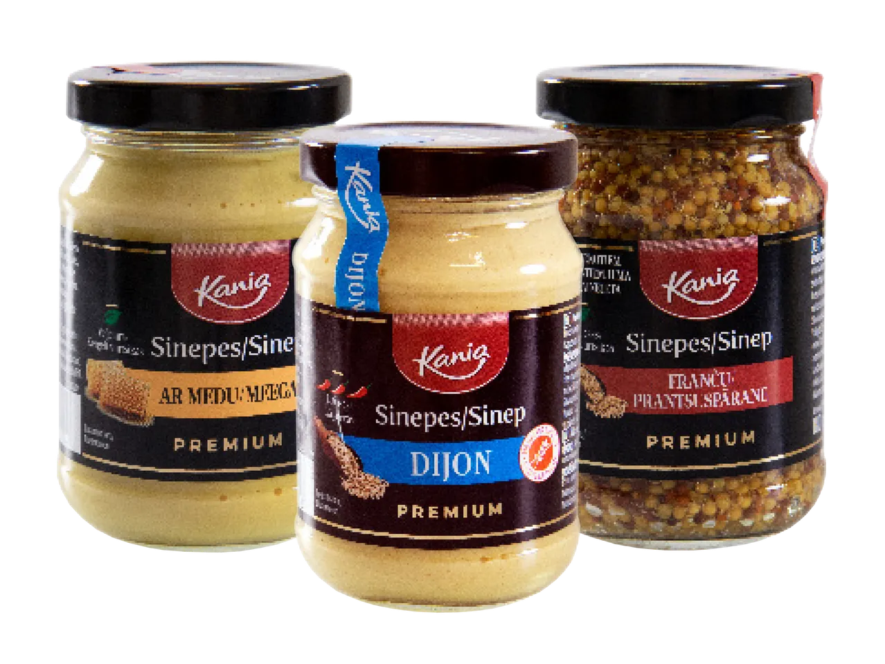 Trīs Kania sinepju burciņas: ar medu, Dižonas un franču graudu sinepes.