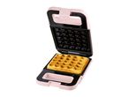 Pink waffle maker with a golden-brown waffle inside.