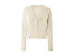 En lys beige cardigan.