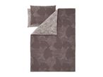 Reversible bedding set with a brown and beige leaf pattern, including a duvet cover and pillowcases.