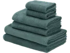 A stack of soft, teal-colored bath towels.