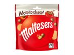A red sharing bag of chocolate-covered malt balls with a Fairtrade logo.