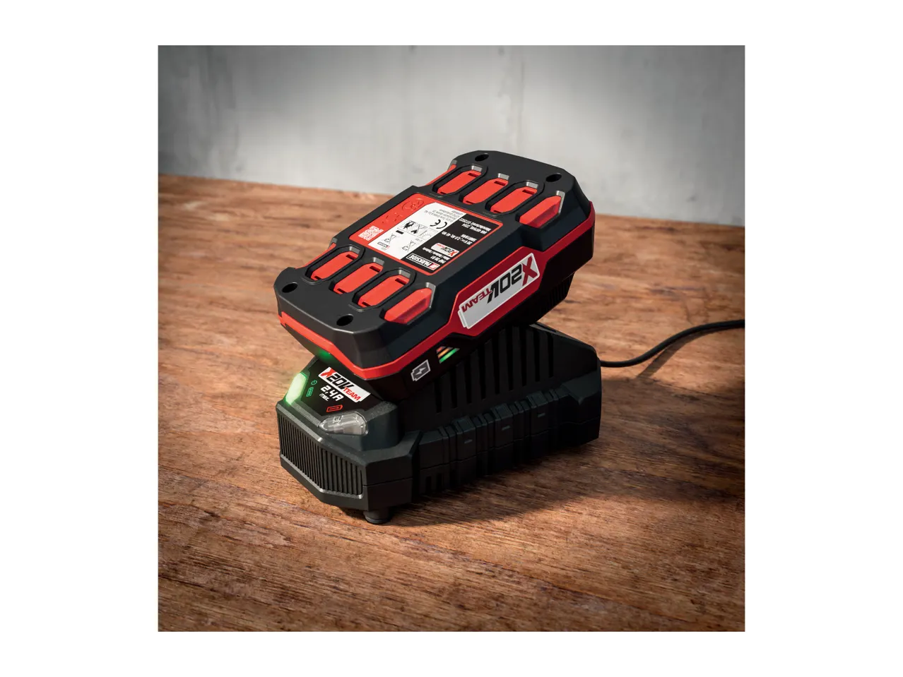 Parkside X 20V Team battery and charger on a wooden surface.