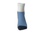 A single blue, white, and black sock, standing upright on a white background.