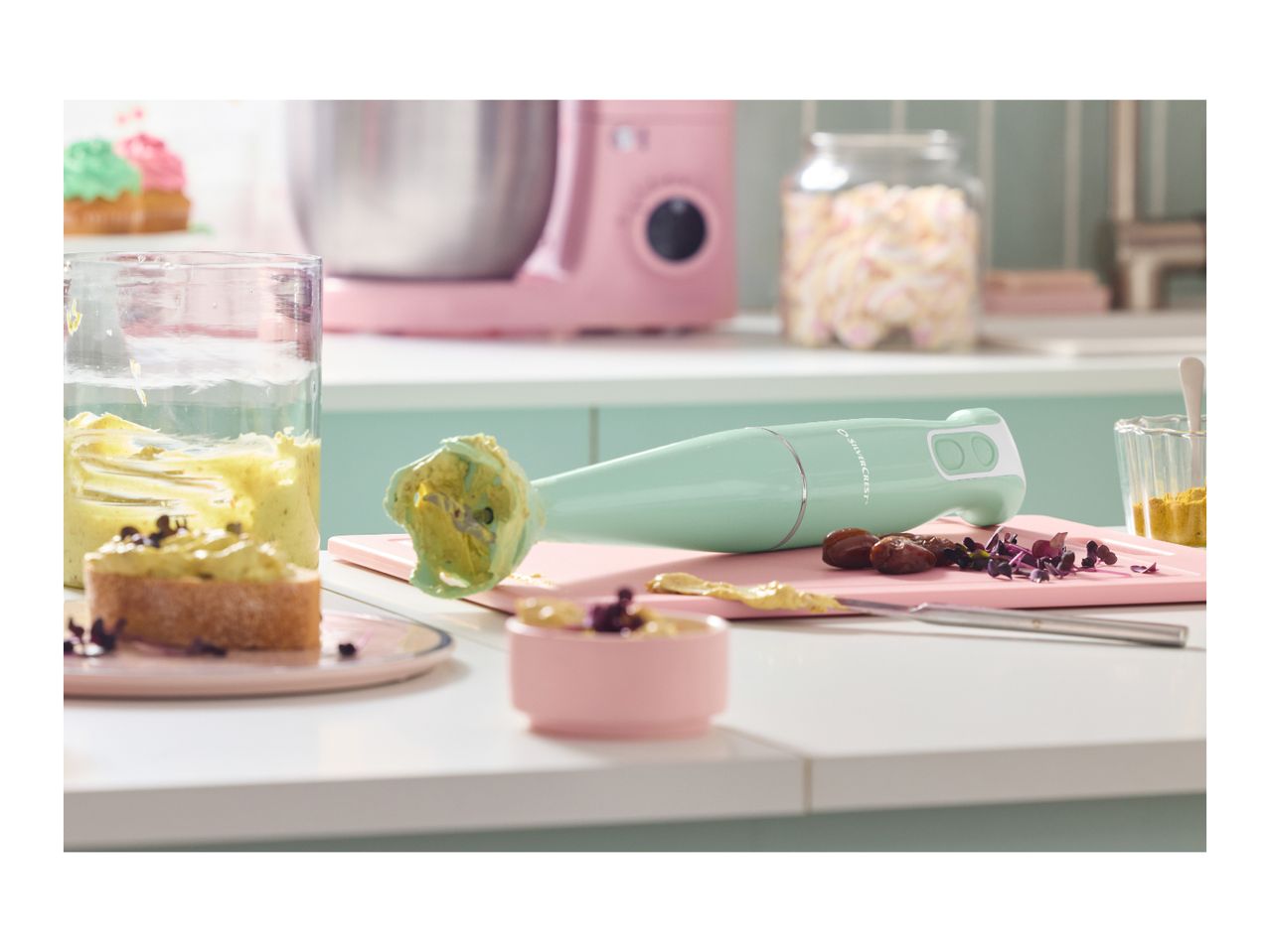 A Silvercrest immersion blender and ingredients on a kitchen counter.