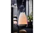 Diffusore di aromi a ultrasuoni LIVARNO con vapore e luce ambientale su un tavolo nero.