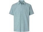 Camicia a maniche corte color verde acqua.
