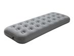Grey inflatable air mattress with a textured surface, angled view