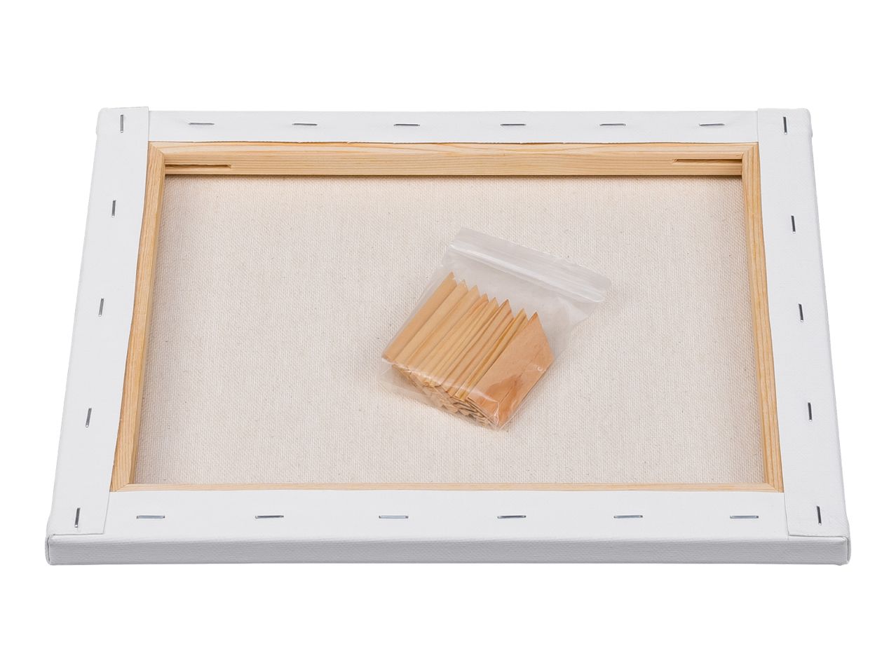 Back of a stretched canvas with wooden stretcher bars and a bag of wooden keys.