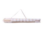 Striped beach umbrella in a carrying bag.
