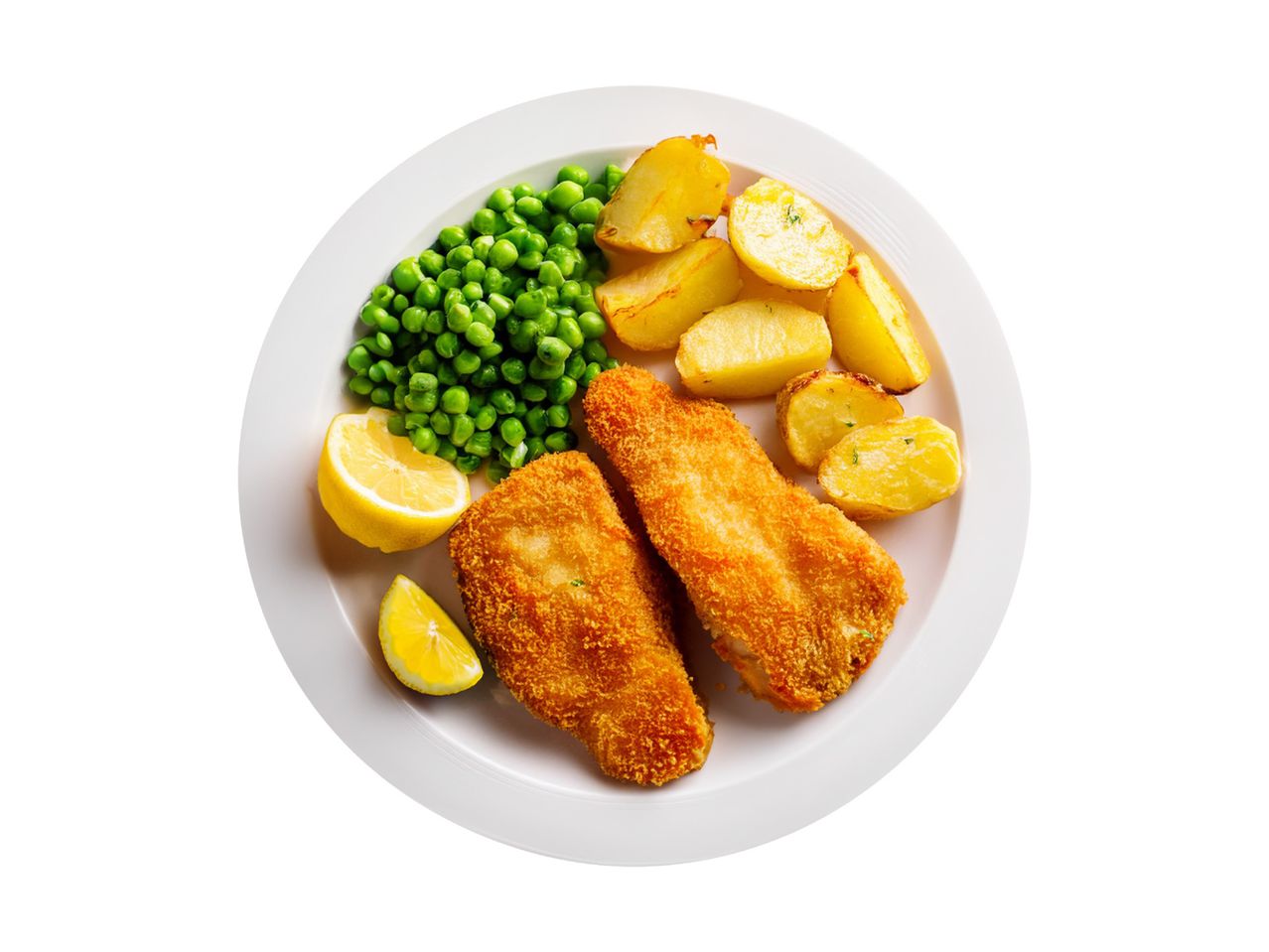 Breaded fish fillets with roasted potatoes, green peas, and lemon wedges on a white plate.