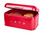 Red retro bread bin with the year 1973 on the front, containing two loaves of bread.