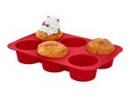 Red silicone muffin tray with three muffins, one topped with mint frosting and sprinkles.