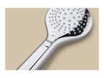 Close-up of a chrome shower head with a button and three spray pattern icons.