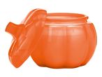 Orange pumpkin-shaped plastic container with its lid slightly ajar, on a white background.