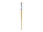 A pair of light-colored wooden chopsticks with a blue and white patterned top.
