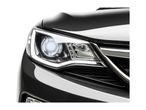 Close-up of a black car's headlight and front grille