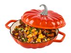 Orange pumpkin-shaped cast iron casserole dish filled with beef stew
