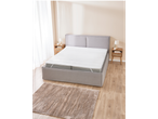 Mattress protector and bed with bedding in a modern bedroom.