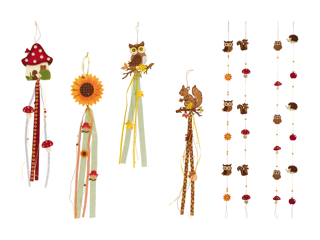 Herbstliche Dekorationen mit Eulen, Eichhörnchen, Pilzen und Sonnenblumen.
