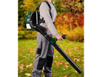 Person wearing a backpack leaf blower and holding the nozzle