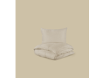 LIVARNO Sängkläder i muslin: cream-colored bedding set with a pillow and a folded duvet.