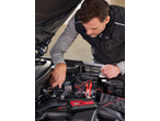 Man charging a car battery with an ULTIMATE SPEED® Car & Motorcycle Battery Charger.