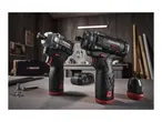 Two cordless drills and a battery charger on a workbench.