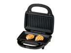 Open electric grill with two grilled chicken breasts inside.