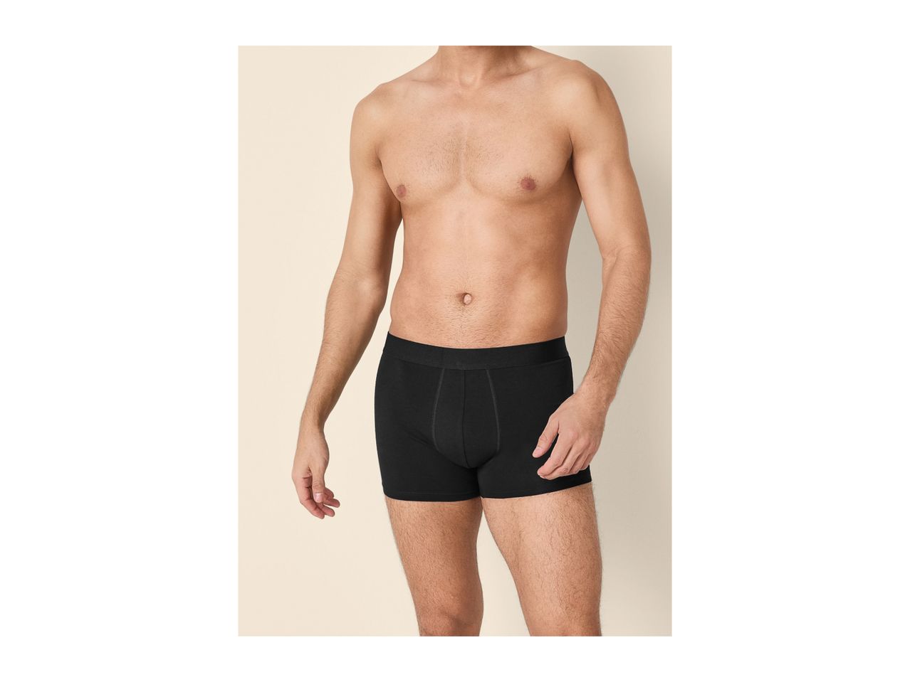 Torso of a man wearing black boxer briefs.