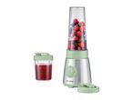 Personal blender with berries, and a cup of blended smoothie.