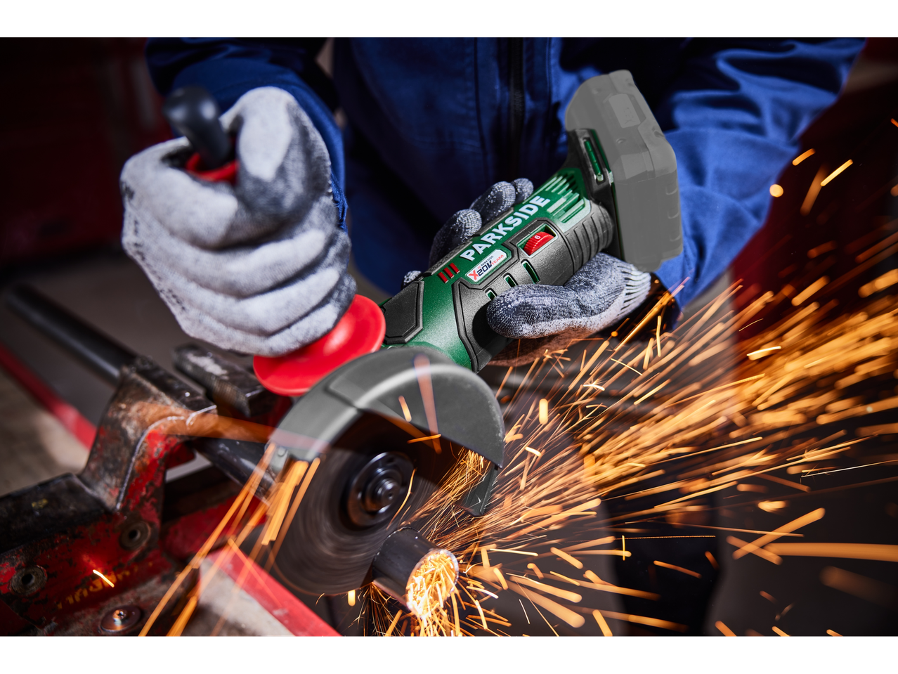 Using a Parkside angle grinder, sparks flying.