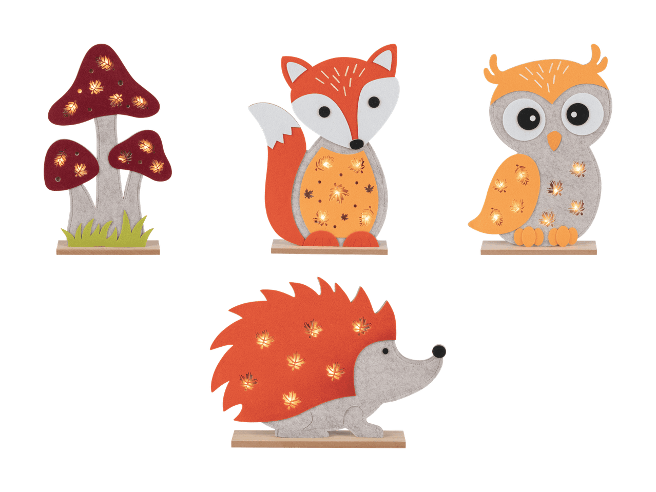 Leuchtende Herbstdekorationen in Form von Pilz, Fuchs, Eule und Igel.