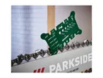 Green multi-use chainsaw gauge measuring the bar groove width of a chainsaw.