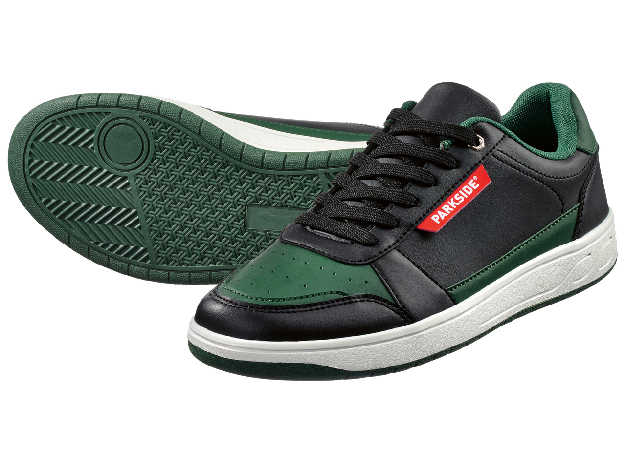 Черни и зелени маратонки с бяла подметка и червени акценти, показващи подметката.