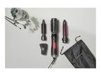 Hair styler with interchangeable brush heads, a concentrator nozzle, and a black storage bag.