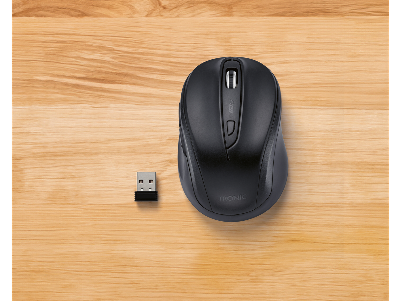 Șoarece wireless TRONIC cu receptor USB pe o suprafață din lemn.