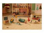 Dollhouse with miniature furniture and figures, including a TV, sofa, and kitchen set.