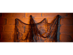 Decorative fishing net hanging on a brick wall with warm lighting.