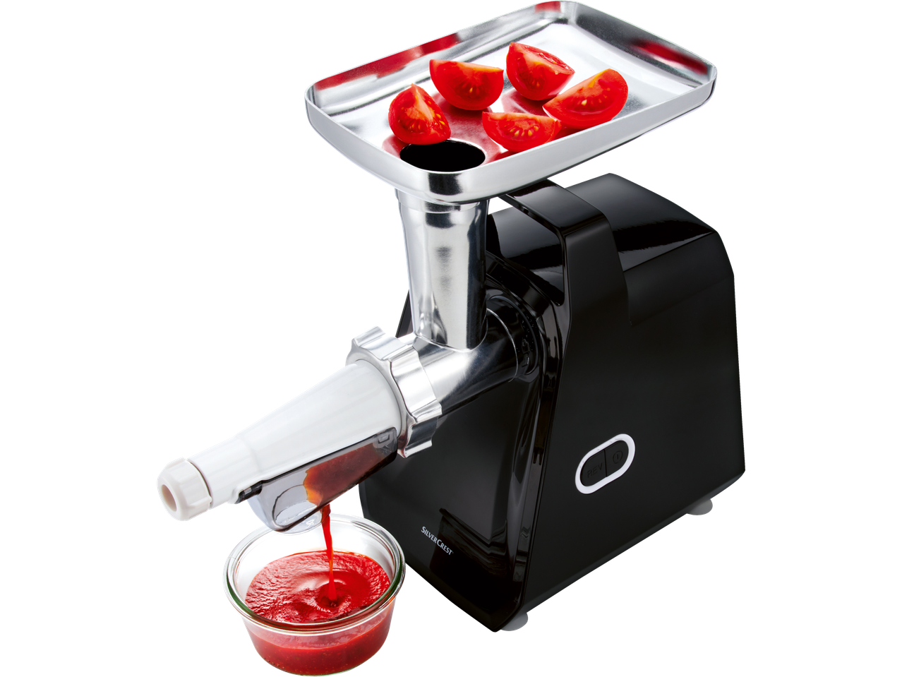 A SilverCrest meat grinder processes tomatoes into sauce.