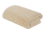 A beige, folded bath towel.